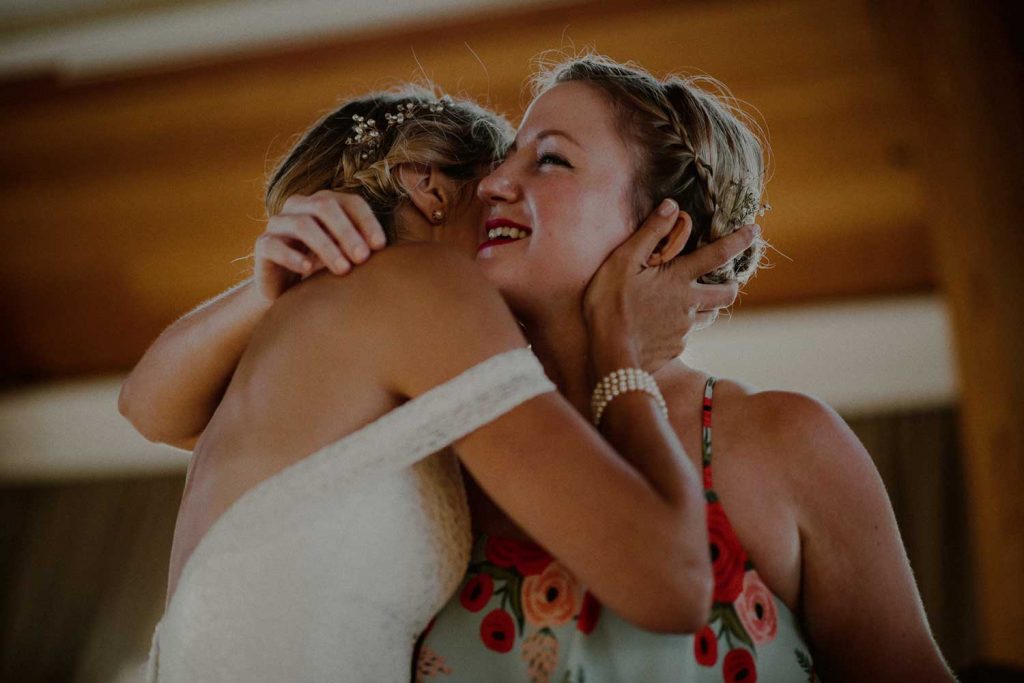 emotional moment between bride and bridesmaid