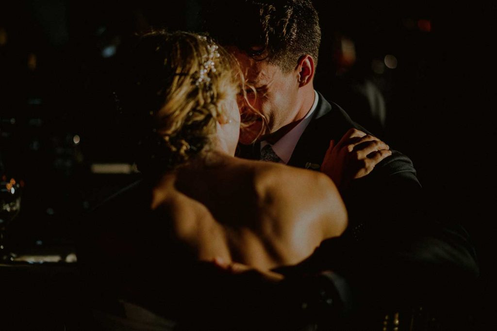 candid moment of bride and groom at wedding