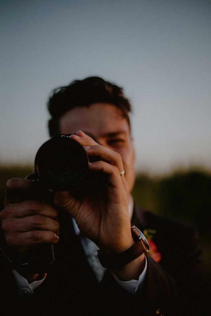 creative groom portrait during sunset bridal portraits