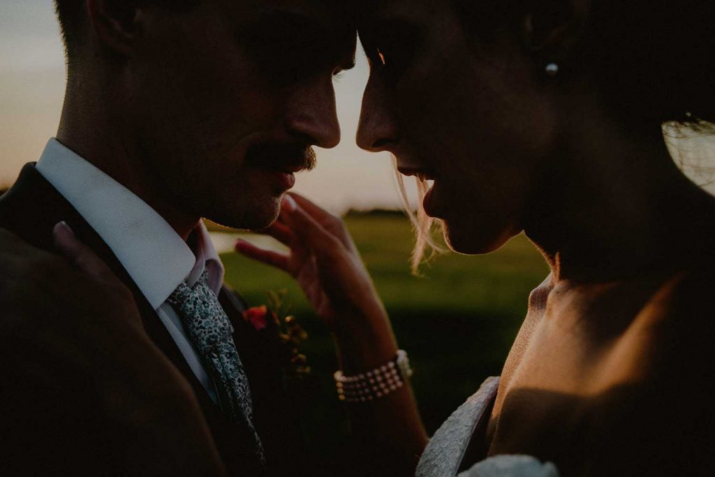 intimate bridal portrait during sunset photo shoot at beach wedding venue