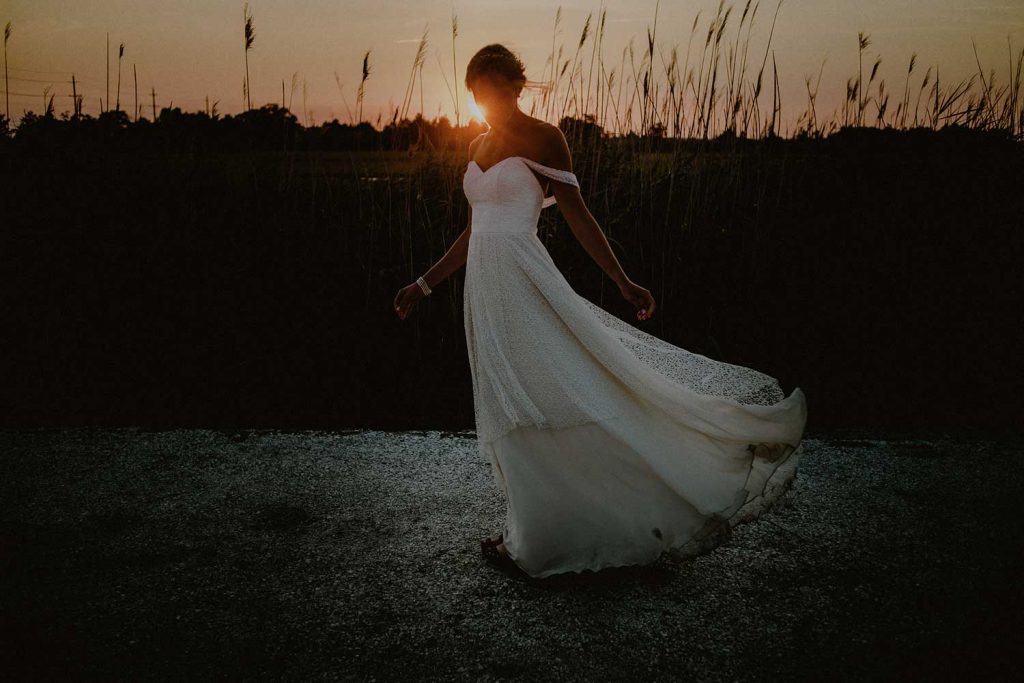 portrait of bride at bonnet island wedding in the marsh at sunset