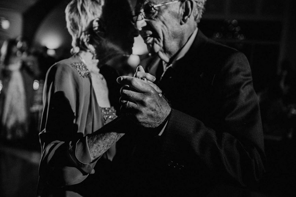 elderly couple dancing at wedding reception