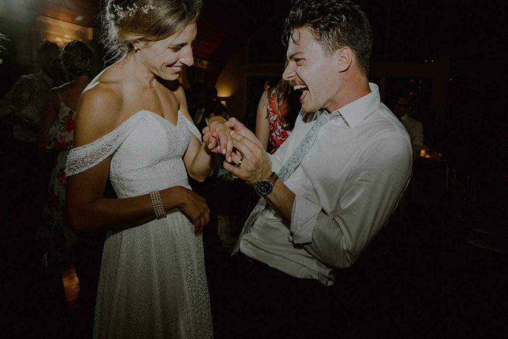 bride and groom enjoy a moment together at their bonnet island wedding reception