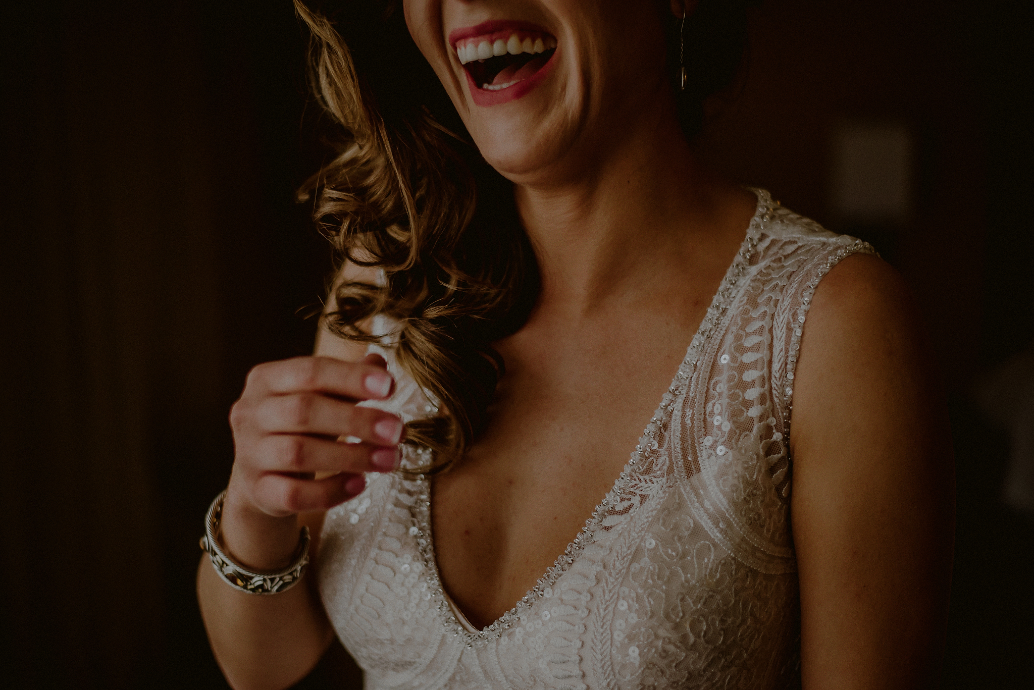 Polish wedding - bride laughing by Carolina Rivera