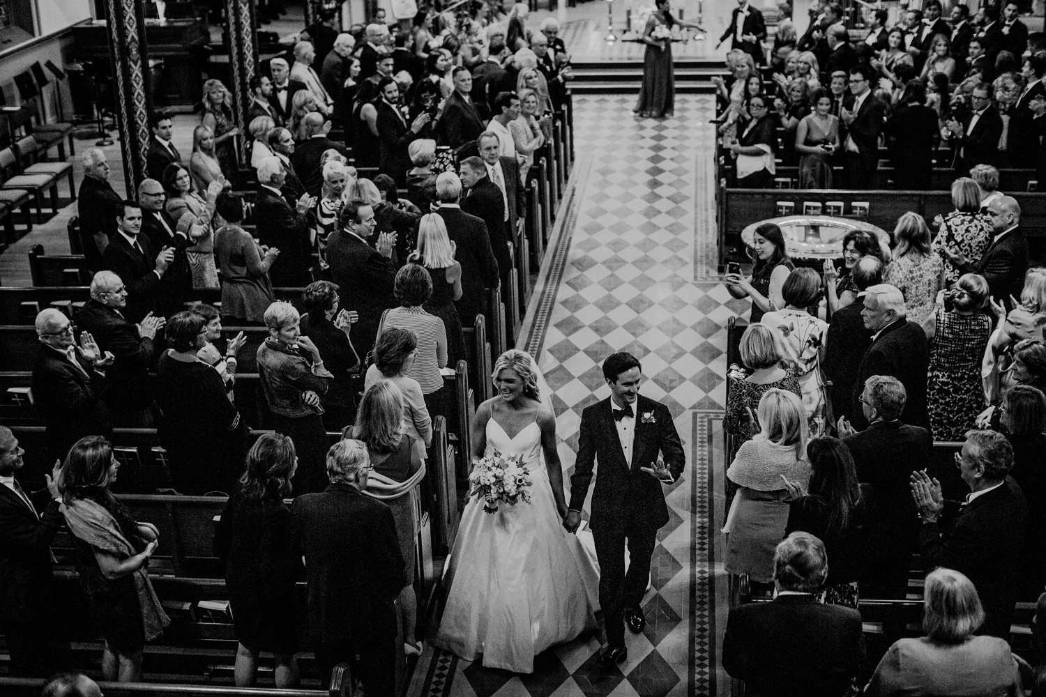 church wedding photos bride and groom walking down the aisle