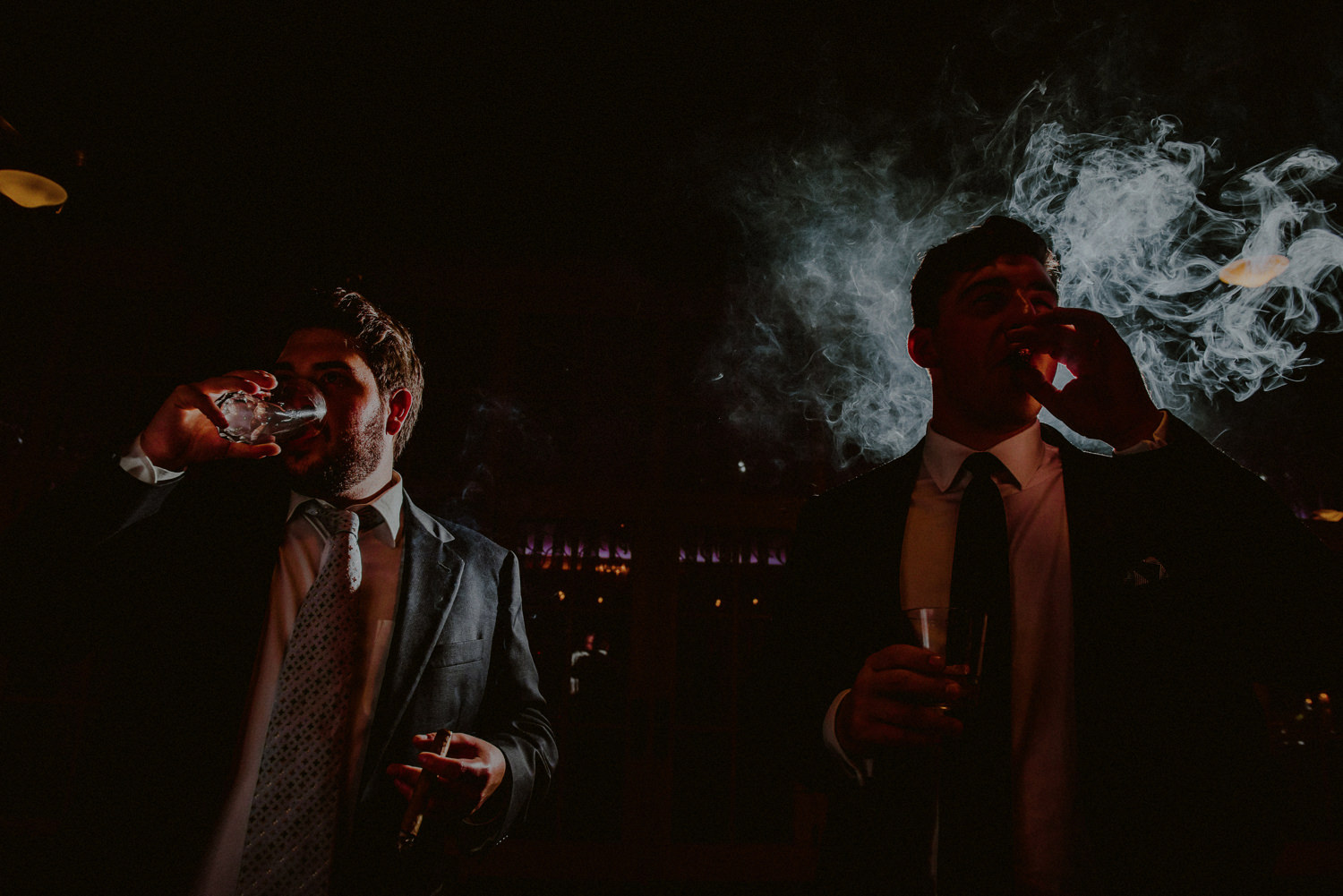 creative wedding photography groomsmen smoking cigars