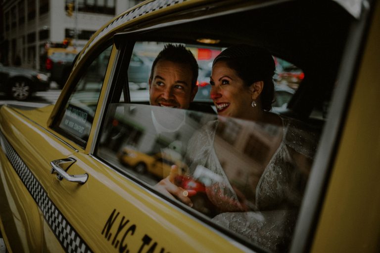 NYC Elopement Photographer Image Of Married Couple In New York City Taxi
