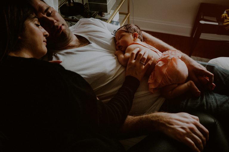 documentary newborn photos of family sleeping on bed in west new york