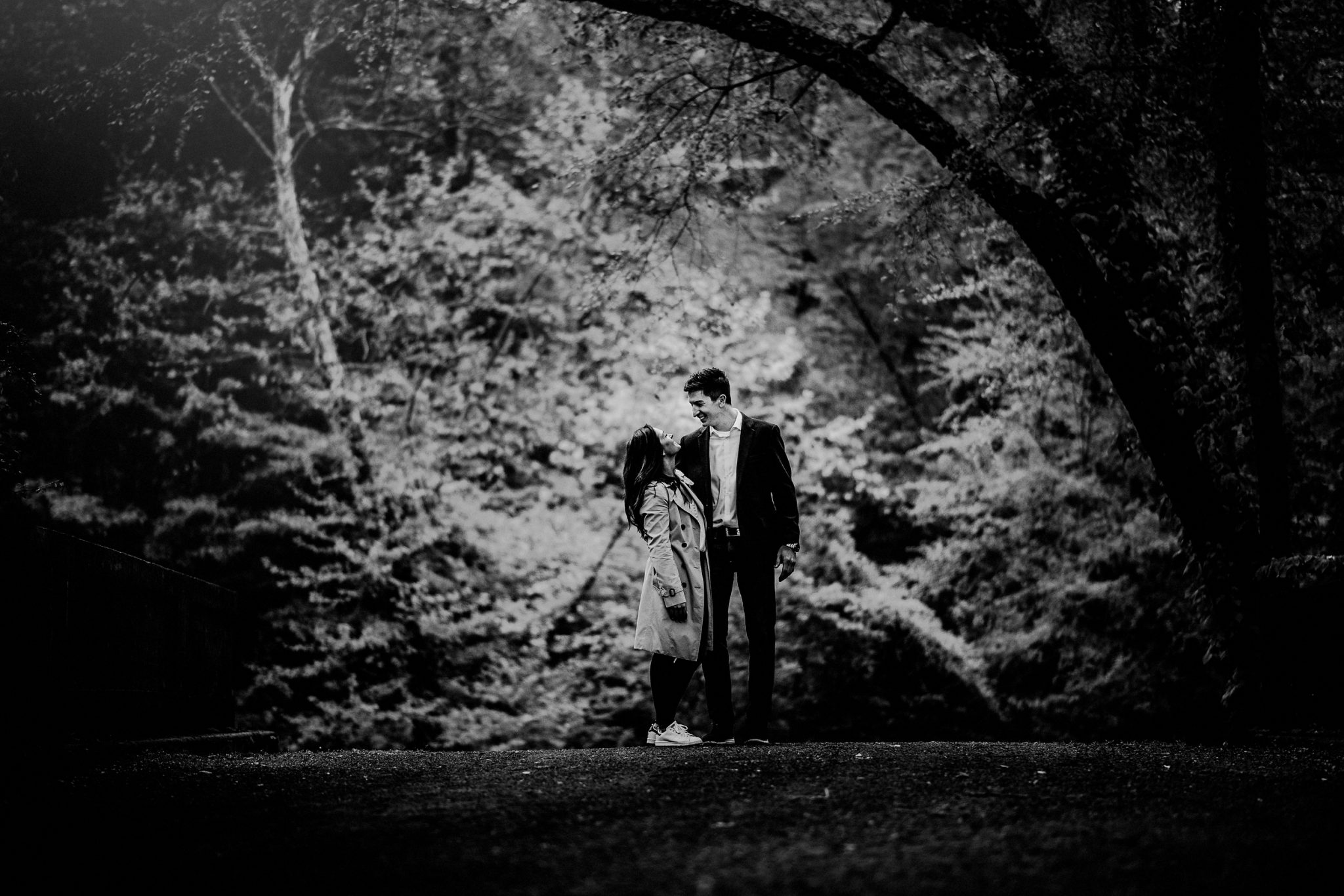 black and white image of couple after surprise proposal