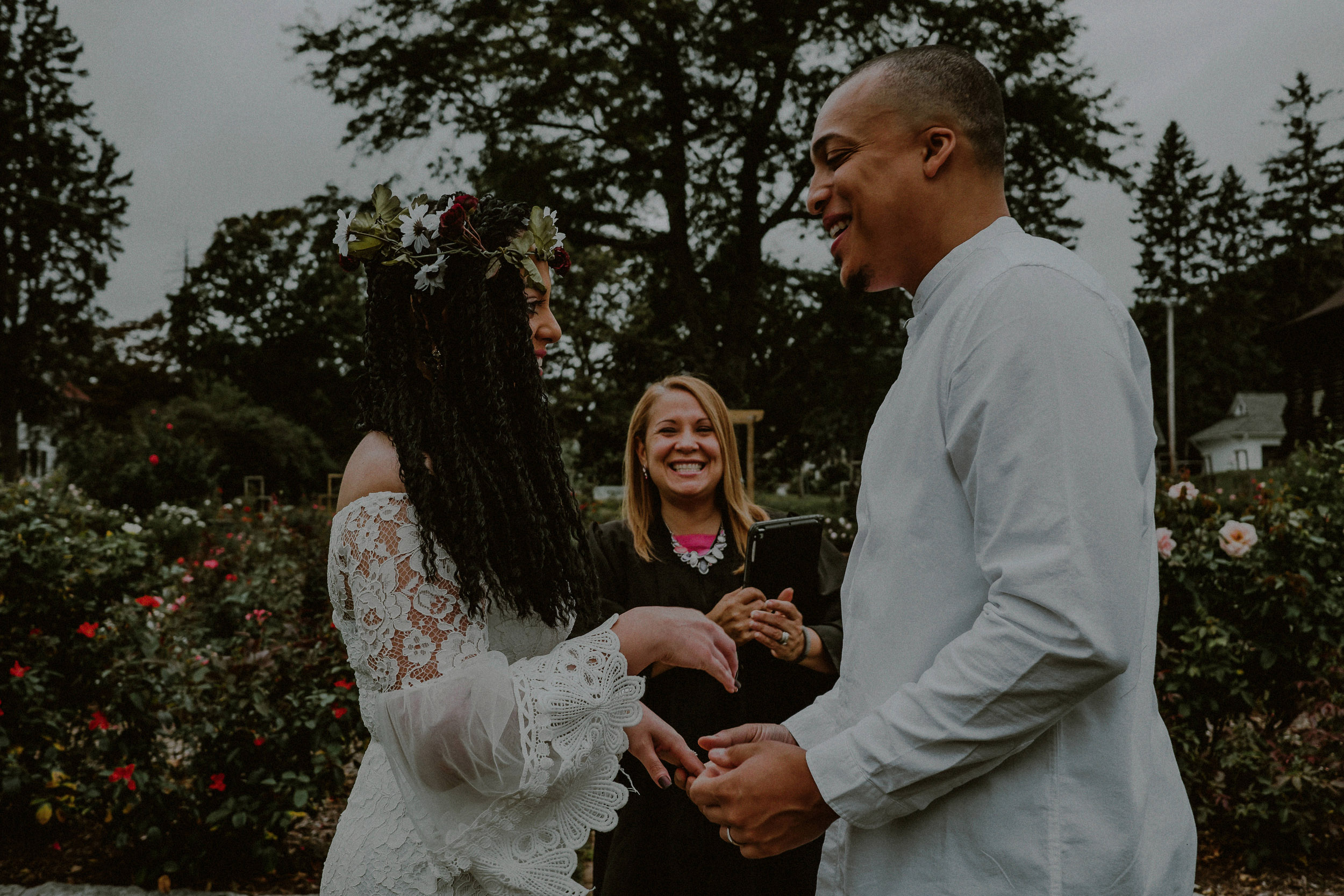 couple eloping in garden with officiant