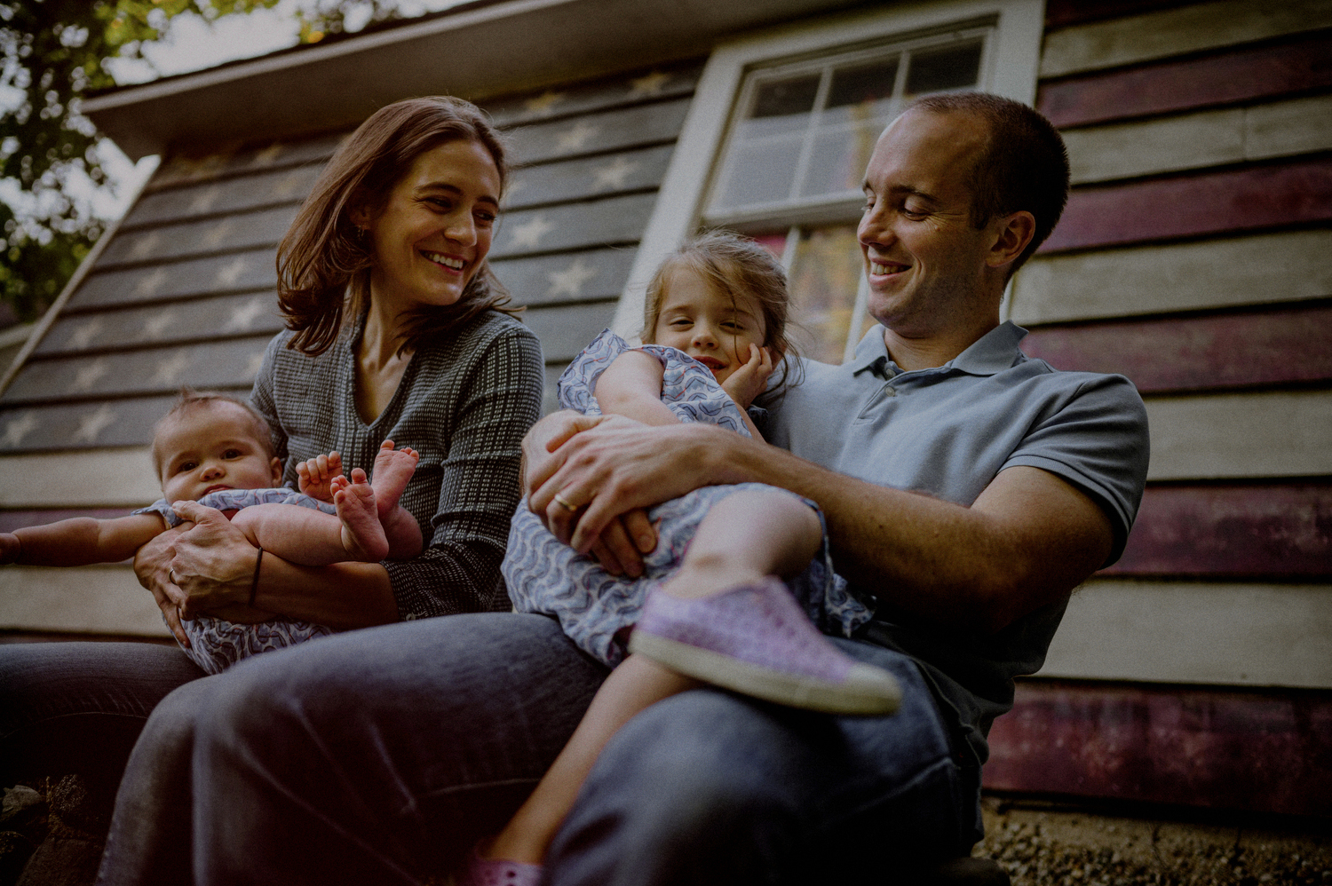 lifestyle family photo candidly posed in front of american flag