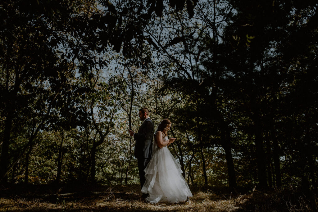 first touch wedding photo of bride and groom reading a letter before their wedding by Carolina Rivera photographer 