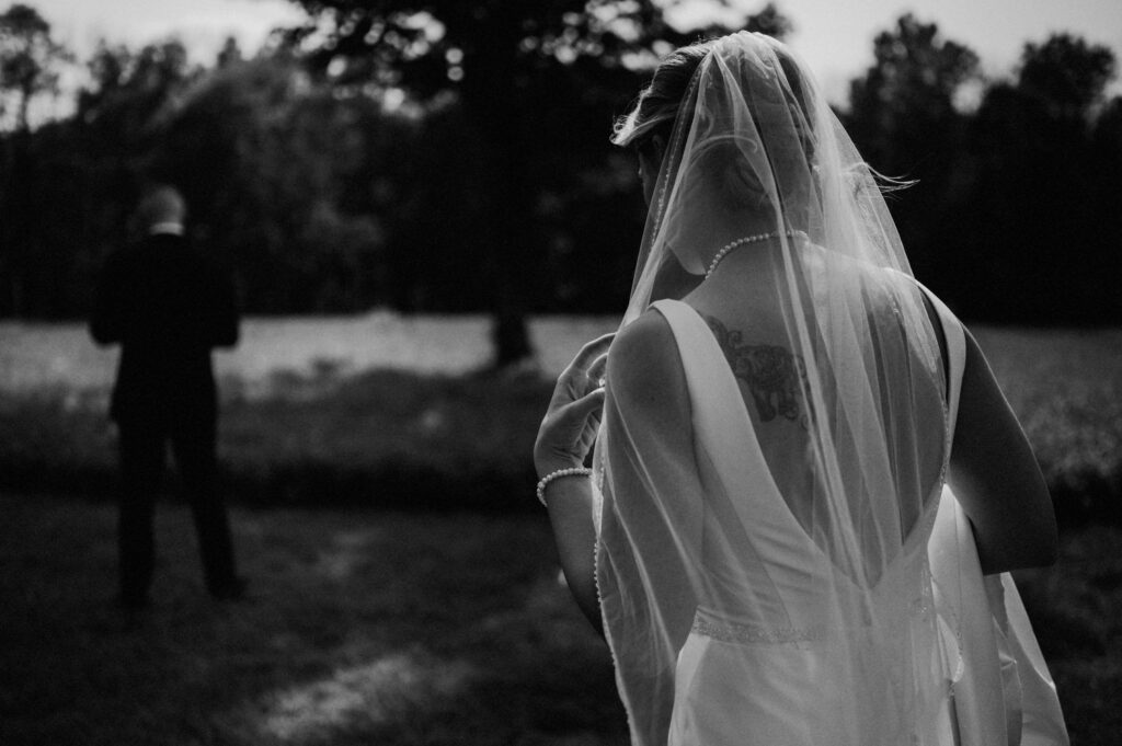 black and white photo of bride and groom's first look