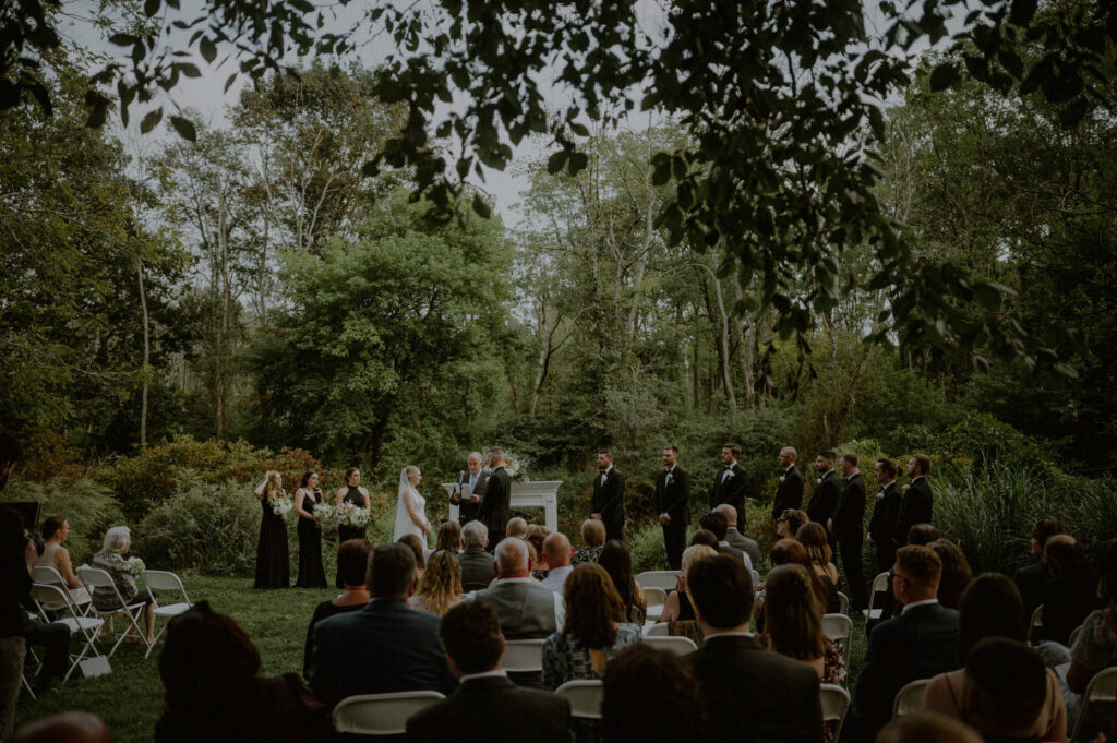 photo of wedding ceremony taking place outdoors