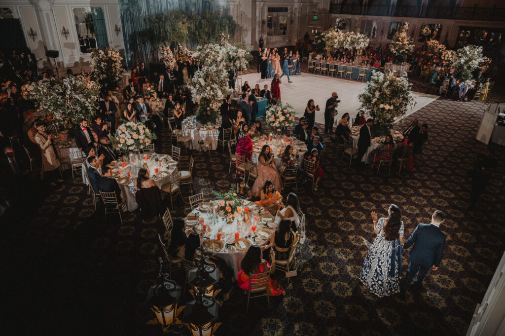 Legacy Castle - Luxury Wedding Venue - Indian bride and groom making grand entrance by Carolina Rivera