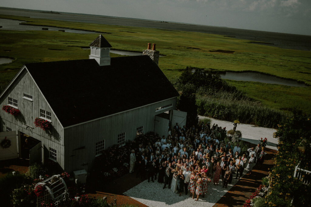 birds-eye view of chapel at bonnet island estate with wedding guests looking up