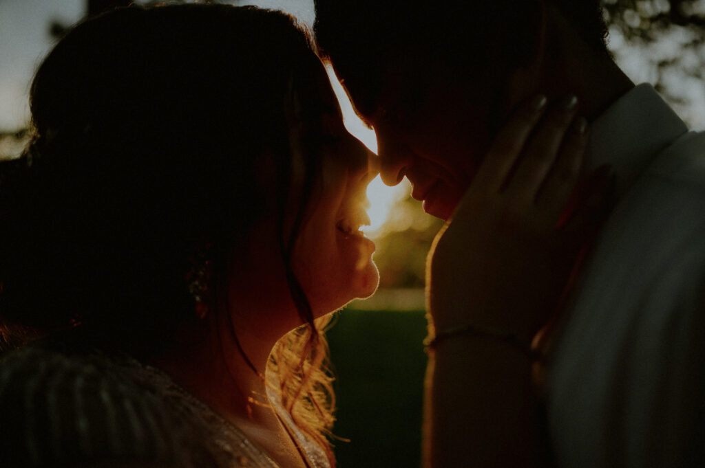 silhouetted couple against the sunset at their natirar wedding