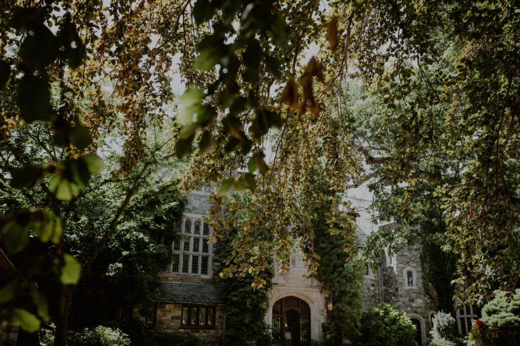 outdoor facade of the skylands manor on the property of the nj botanical gardens surrounded by summer foliage