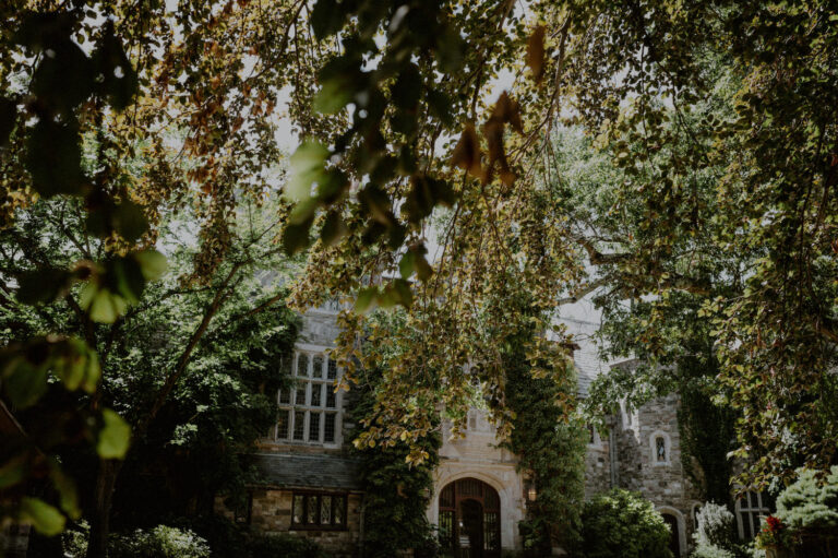 outdoor facade of the skylands manor on the property of the nj botanical gardens surrounded by summer foliage