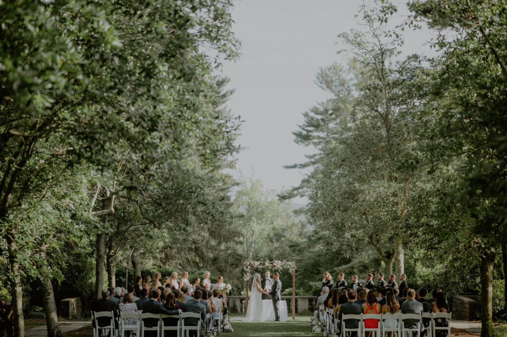 outdoor summer wedding ceremony on the grounds of the nj botanical gardens - Skyland Manor wedding