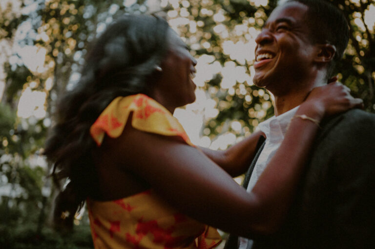 candid image of couple laughing and blurred out
