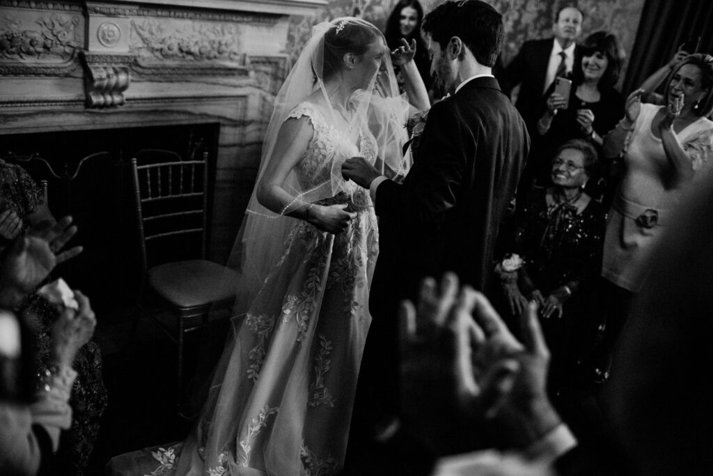 documentary wedding image in black and white of jewish wedding bedeken event