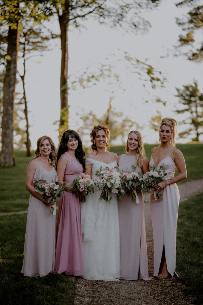 classic wedding party portrait of bridesmaids in a row