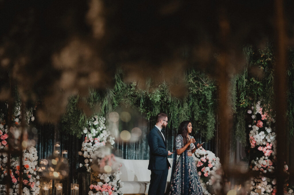 indian bride and groom speaking at their wedding 