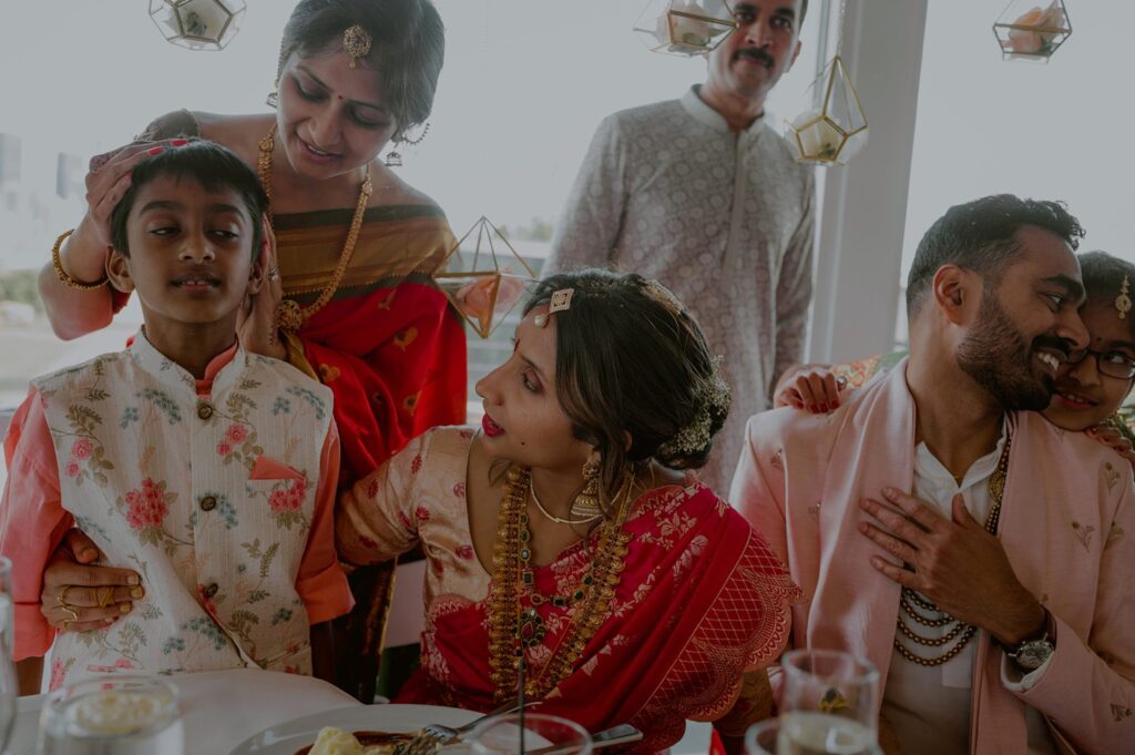 candid moments between bride and groom and children at wedding