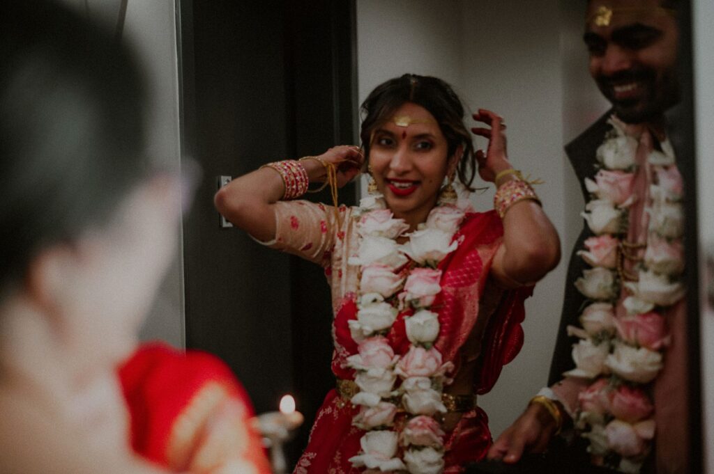 indian bride and groom entering apartment