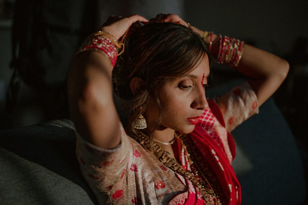 intimate moody moment of bride putting her hands up to her head