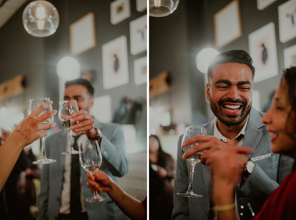 groom laughing with toasts and glasses in the air