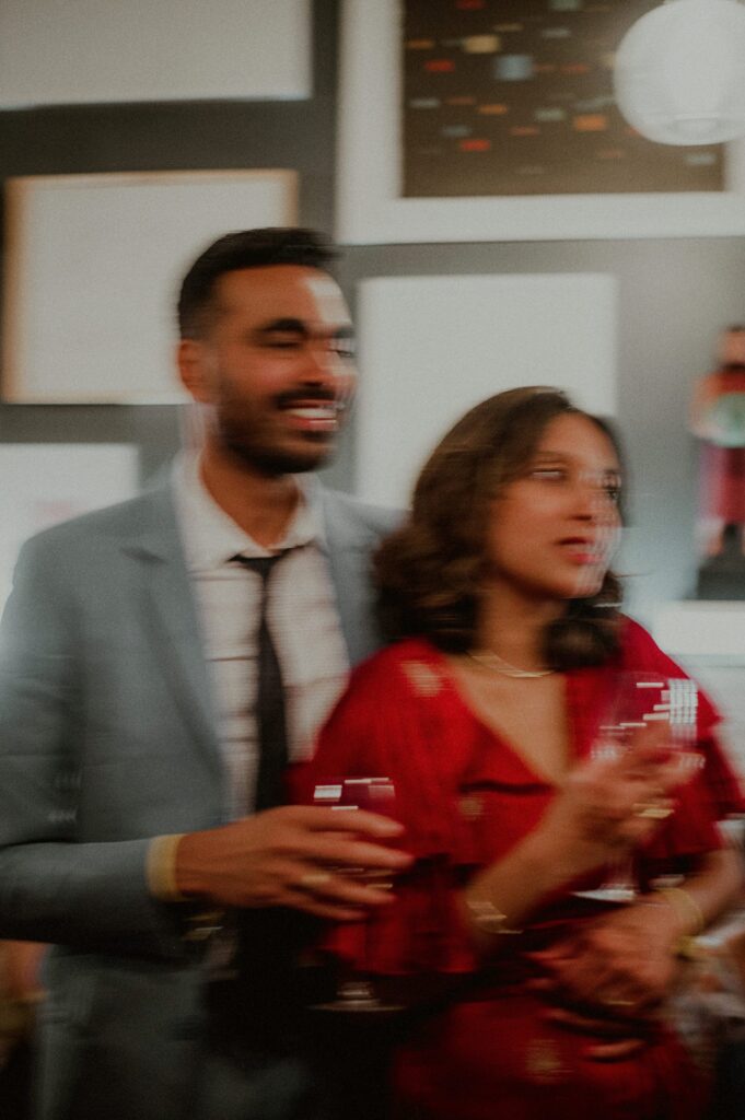 candid moment of bride and groom embraced with movement blur