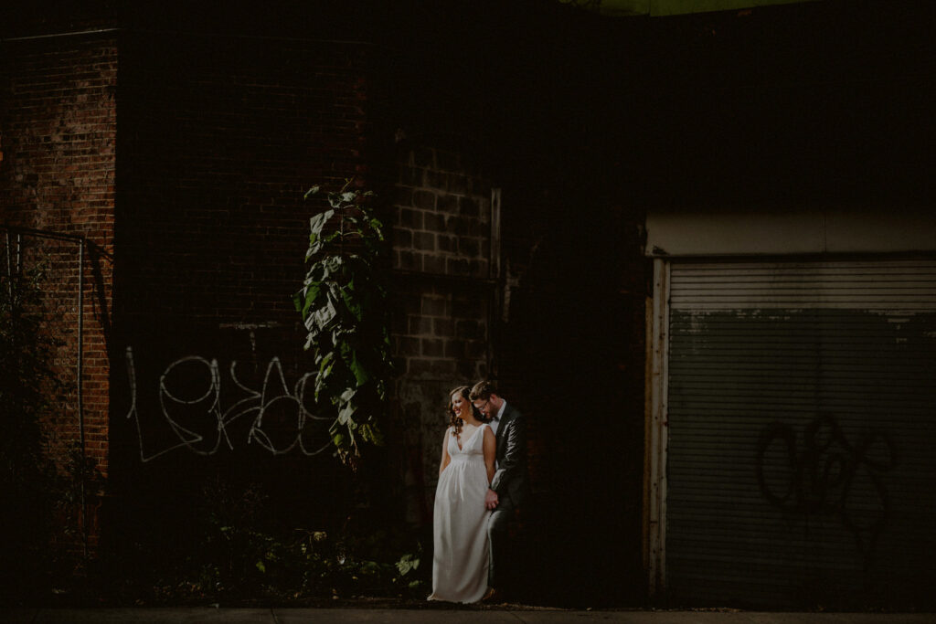 bride and groom with urban landscape wedding photo in jersey city arts district