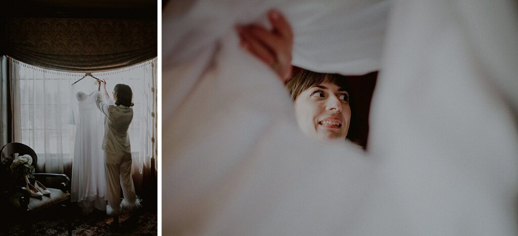 bride getting dressed and picking up wedding dress from window