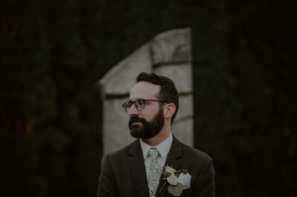 groom patiently waiting at sculpture garden for ceremony to begin