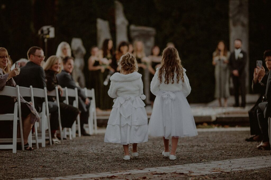 flower girls walking into ceremony from behind