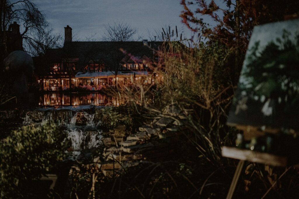 external view of rats restaurant with view of the lake at dusk