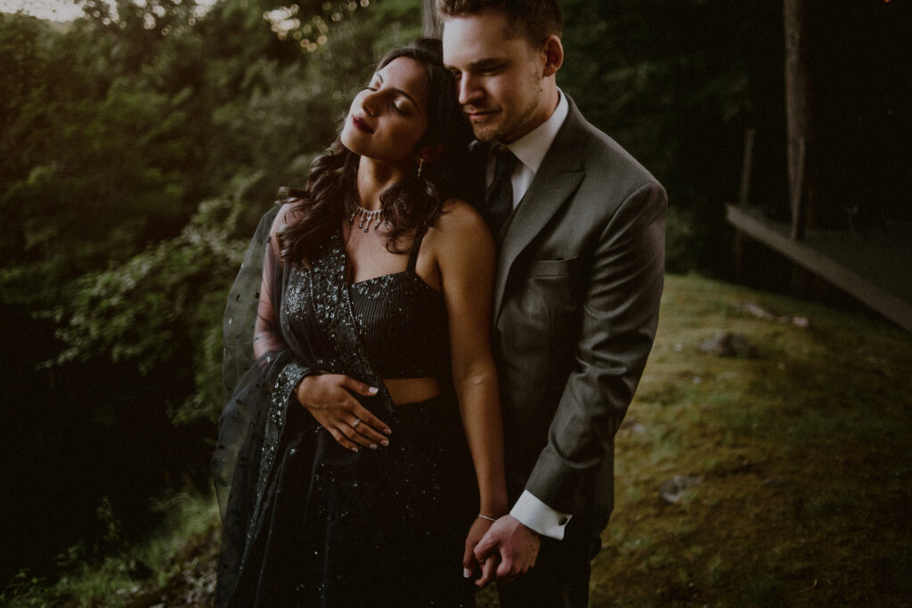 couple embraced in front of mountain landscape for private and intimate elopement