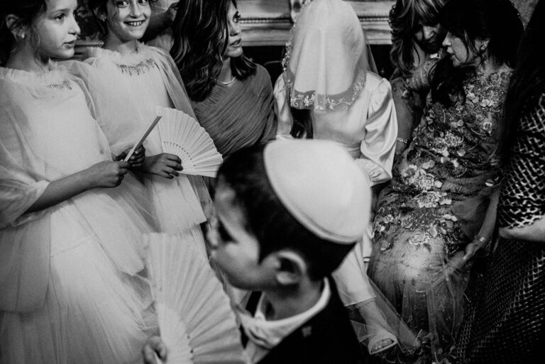 black and white image of bride at orthodox jewish wedding covered by veil at bedeken event