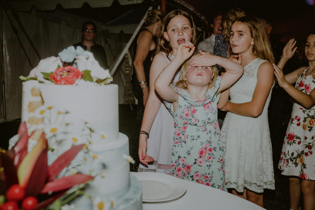 Authentic Moments Of Children During Wedding Cake Cutting