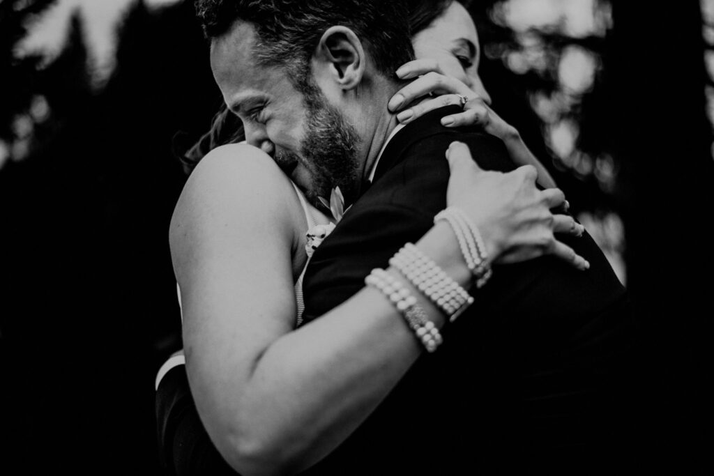 Bride Groom Black And White Photo Crying While Embracing After First Look