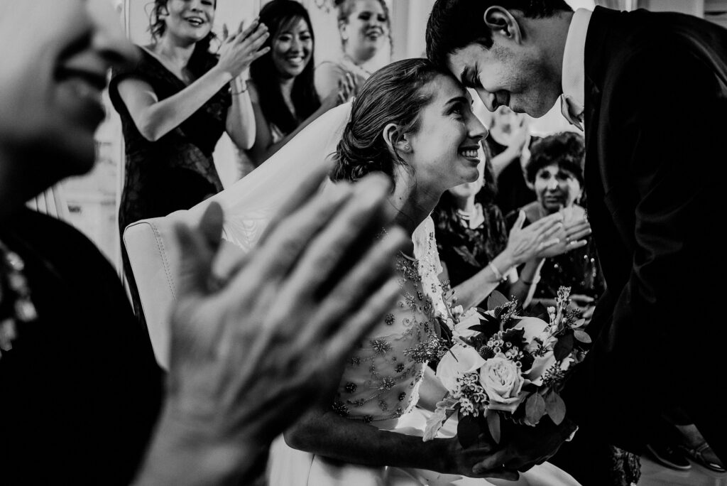 Bride Groom Touching Heads During Bedeken At Jewish Wedding Ceremony