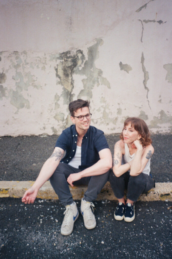 Casual Unposed Photo Man Woman Couple On Steps During Engagement Session