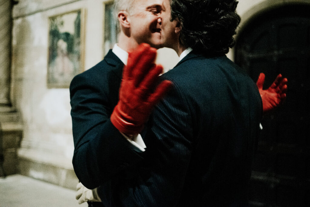Grooms Kissing With Red Gloves After Nyc Ceremony