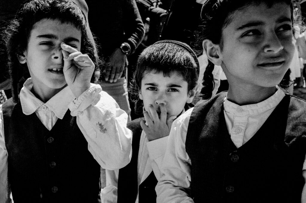 Orthodox Jewish Boys During Ceremony Picking Nose