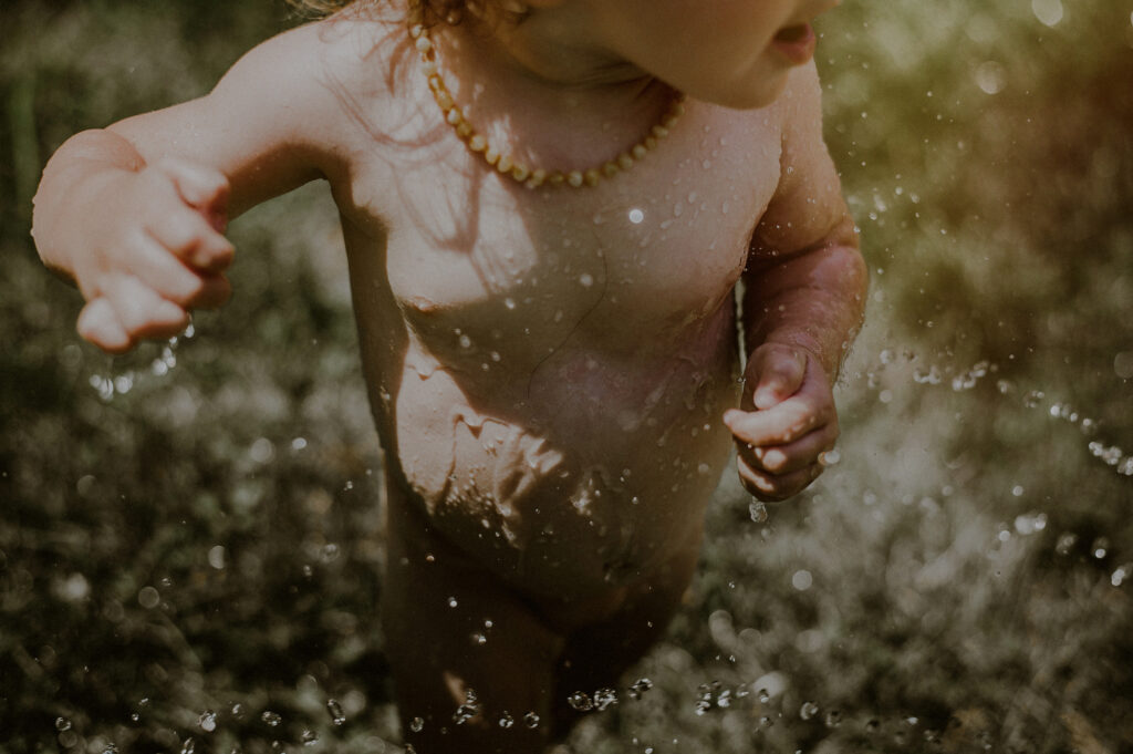 Tender Moment Child Playing With Water Documentary Family Session