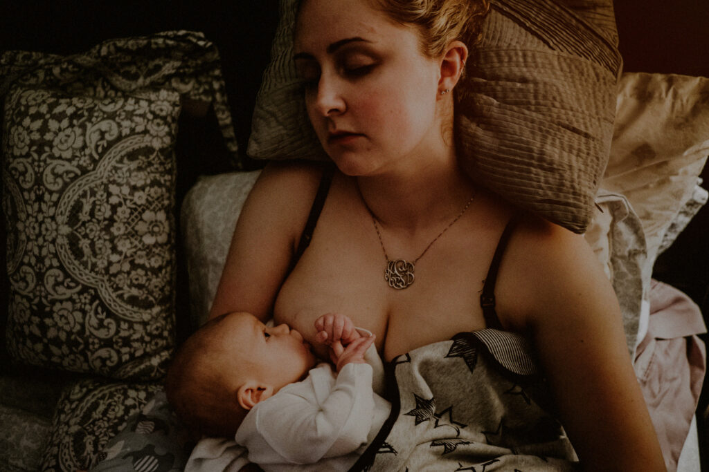 Tired Mother During Breastfeeding Moment Documentary Family Session